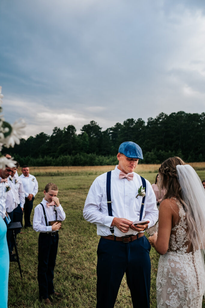 Groom reading vows during ceremony